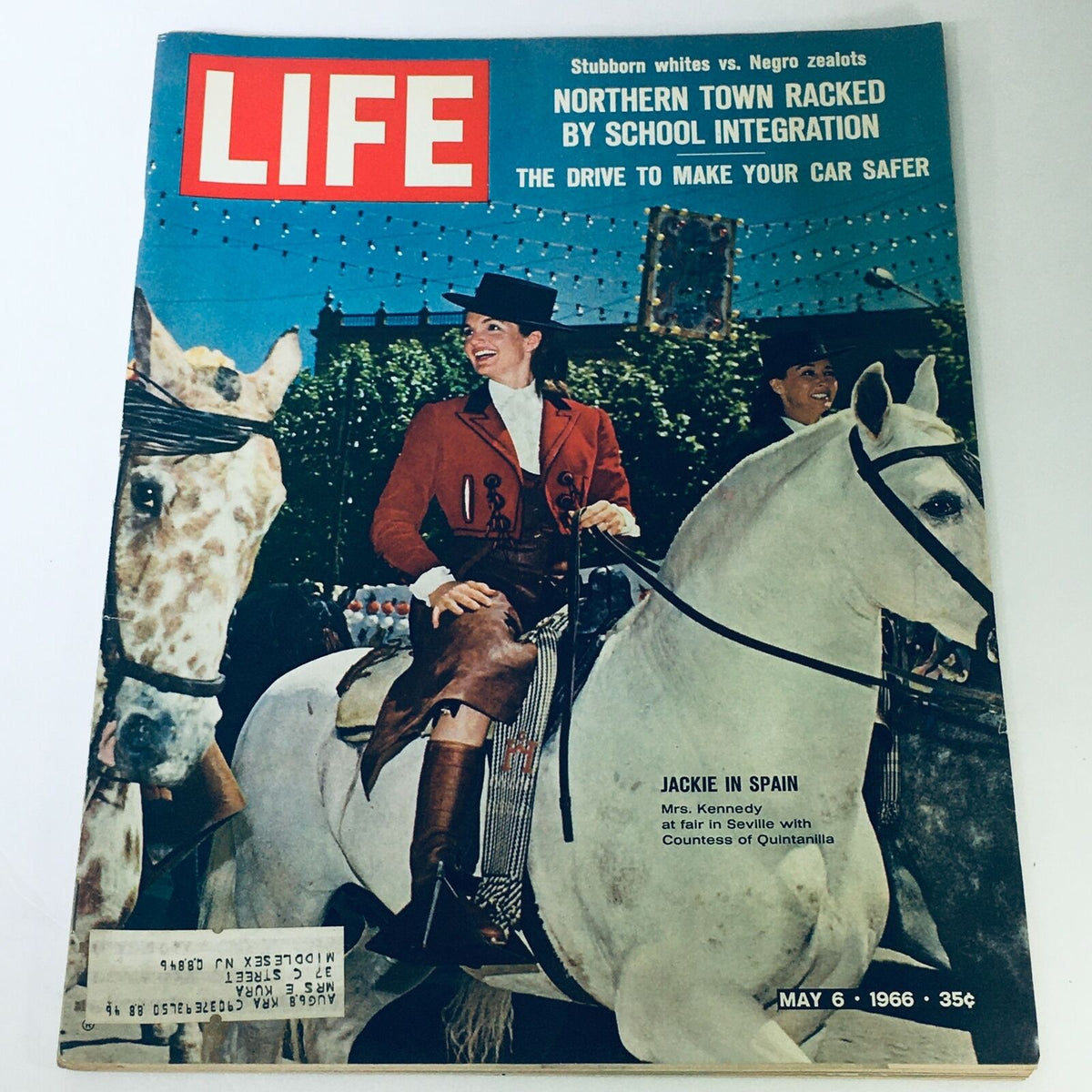 Vintage Life Magazine cover from May 6, 1966, featuring Jackie Kennedy at a fair in Seville, Spain, showcasing her elegance on horseback in a vibrant red outfit.