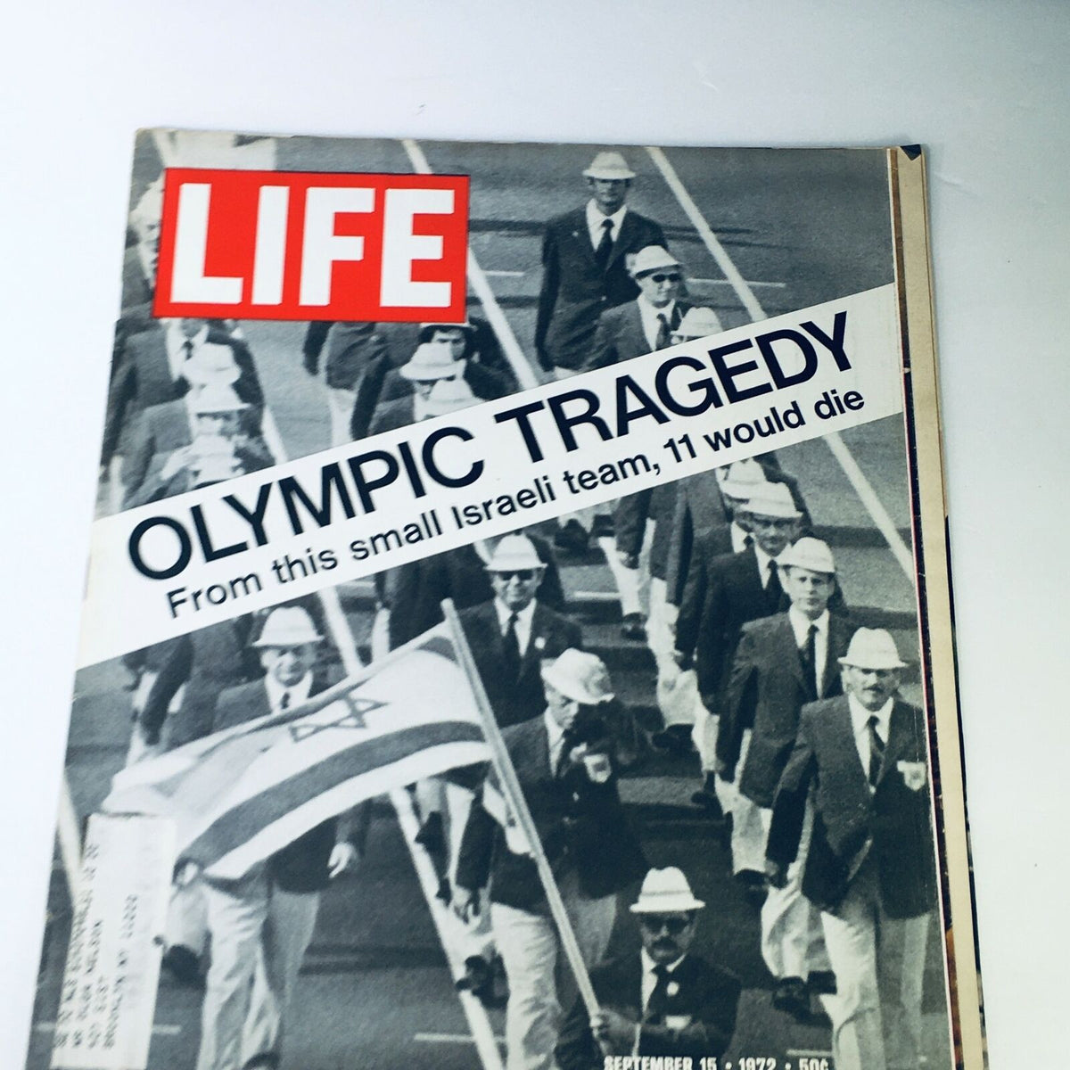 Cover of VTG Life Magazine from September 11, 1972, featuring the headline 'OLYMPIC TRAGEDY - From this small Israeli team, 11 would die'. The image shows the Israeli team in official attire during the Munich Olympics, capturing a poignant moment in sports history.