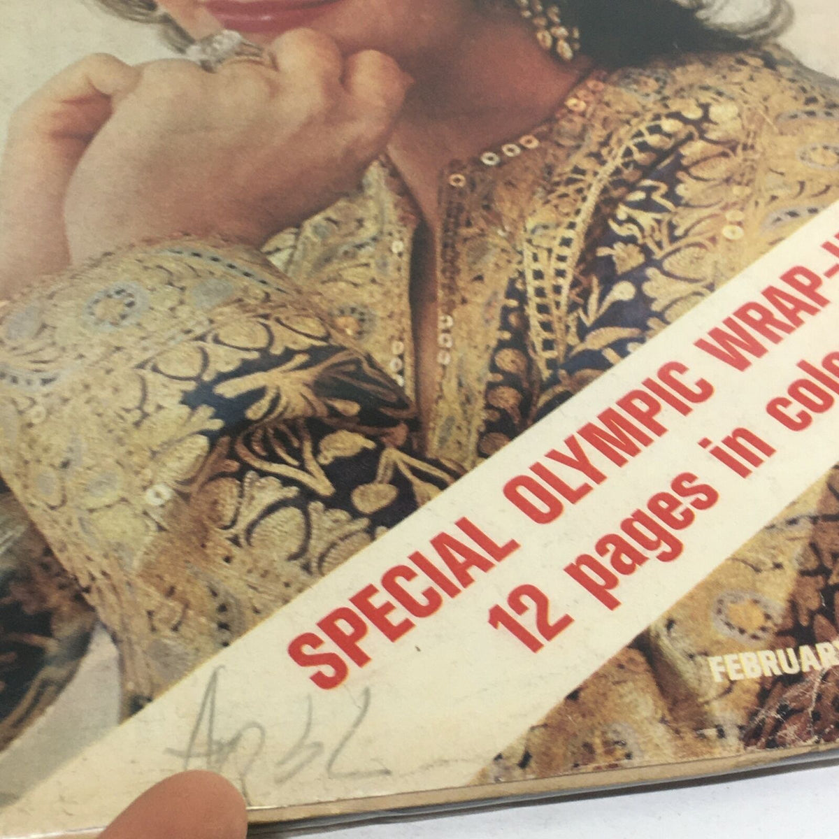 Detail of the cover of VTG Life Magazine: February 25 1972, showcasing Liz Taylor's ornate dress and the 'Special Olympic Wrap-Up' text.