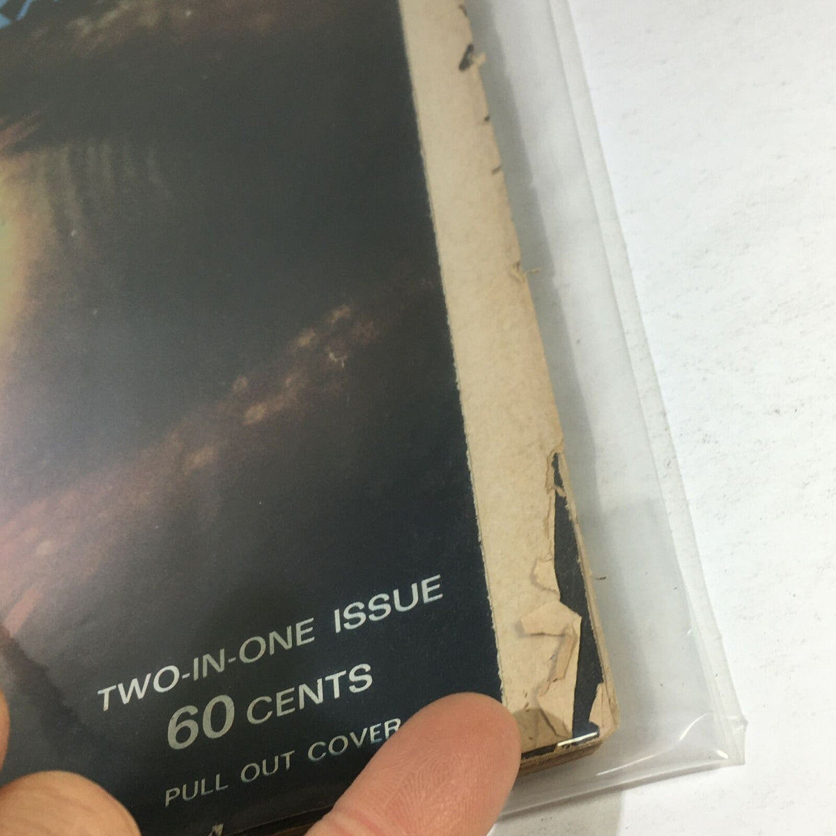 Close-up view of the damaged side of VTG Life Magazine: December 23 1966, showing wear and tear on the cover.