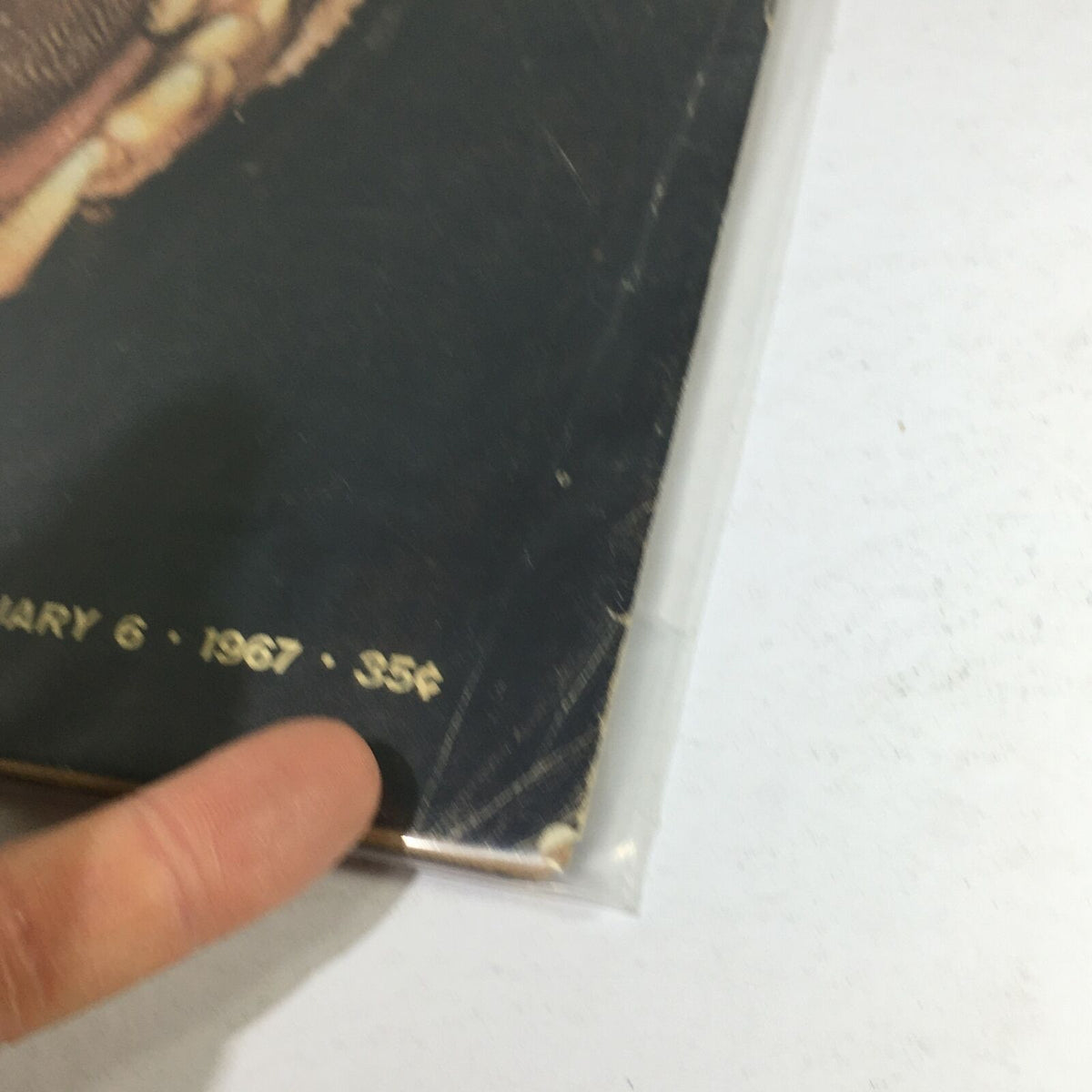 Detail shot of the bottom corner of the VTG Life Magazine January 6, 1967 cover, highlighting the publication date and price, along with signs of wear consistent with age.