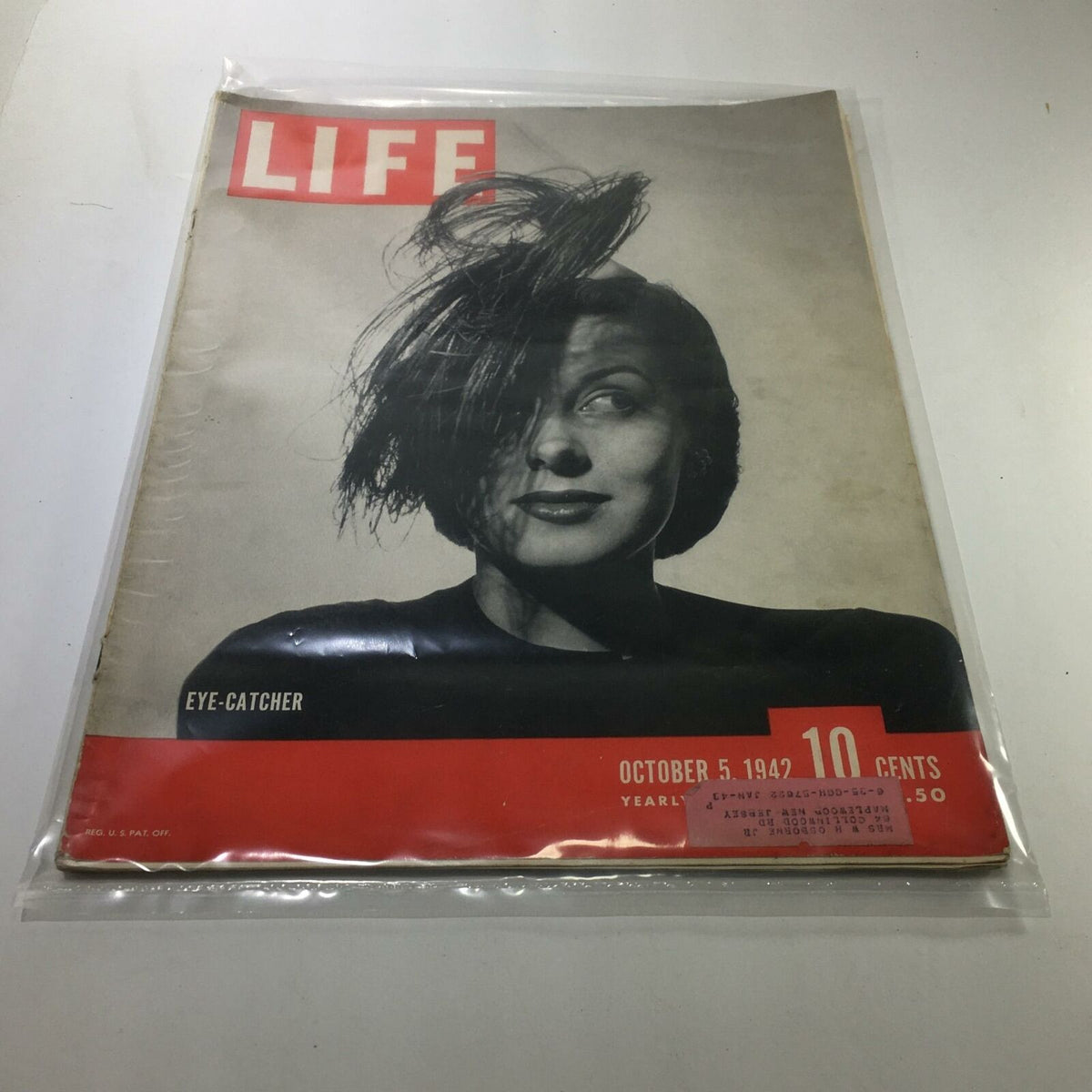 Life Magazine cover from October 5, 1942, featuring striking black and white photography of a woman, labeled as 'Eye-Catcher'. This vintage magazine is a collectible piece reflecting American culture during World War II.