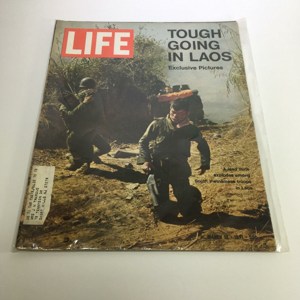 Cover of Life Magazine from March 12, 1971, featuring the title 'A Land Mine Explodes Among South Vietnamese Troops' with imagery depicting the challenges faced by soldiers in Laos.