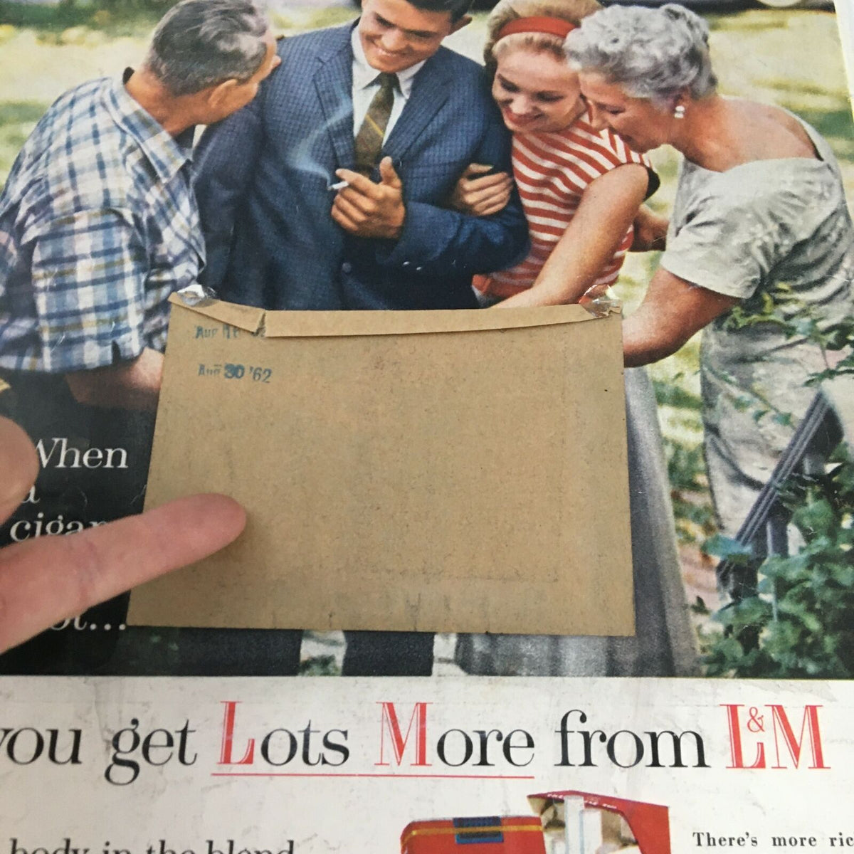 Back cover of the VTG Life Magazine July 27 1962, revealing an address label, pencil markings, and a group of people laughing together outdoors.
