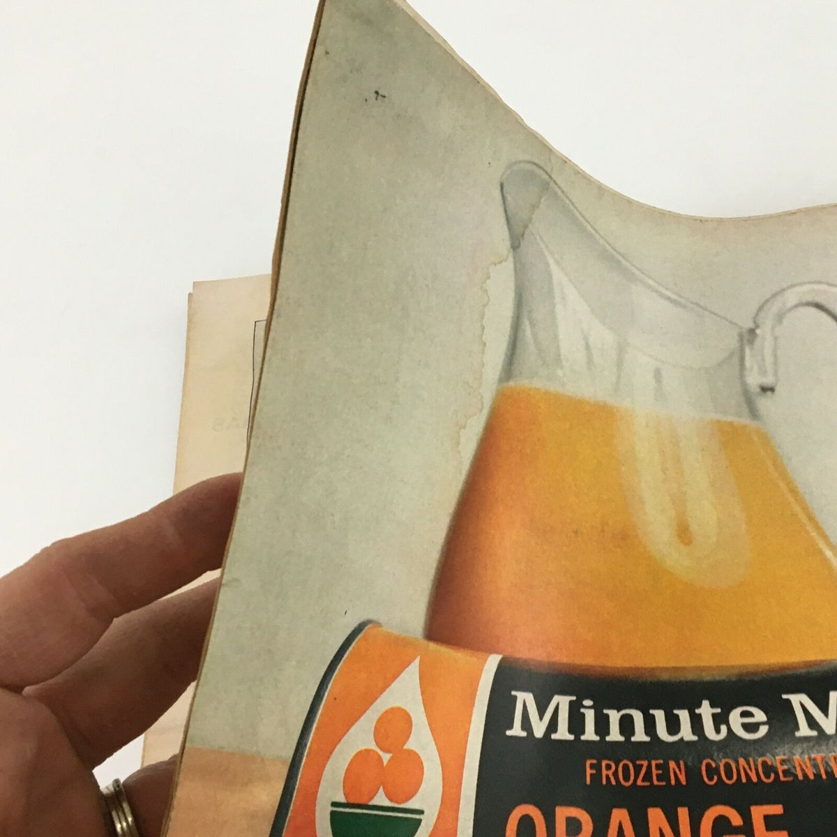 Detailed view of a vintage magazine page featuring Minute Maid orange juice advertisement with a pitcher of orange juice and a can, from the VTG Life Magazine March 14 1969 The Daring Contraption Called LEM Cover Feature.
