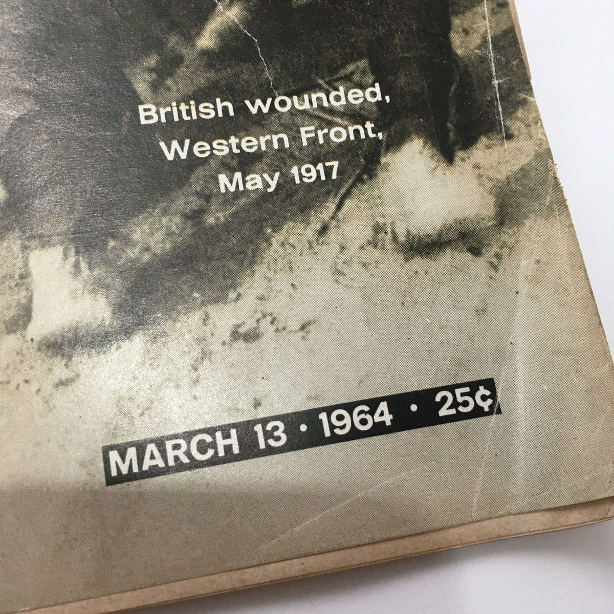 Close-up view of the publication date 'March 13, 1964' and the price of 25 cents on the cover of the Vintage Life Magazine, 'The First Word War'.