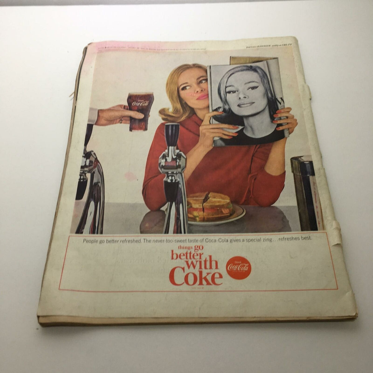 Vintage Life Magazine March 13 1964 cover featuring a woman enjoying Coca-Cola in a diner setting, promoting the message 'things go better with Coke'.
