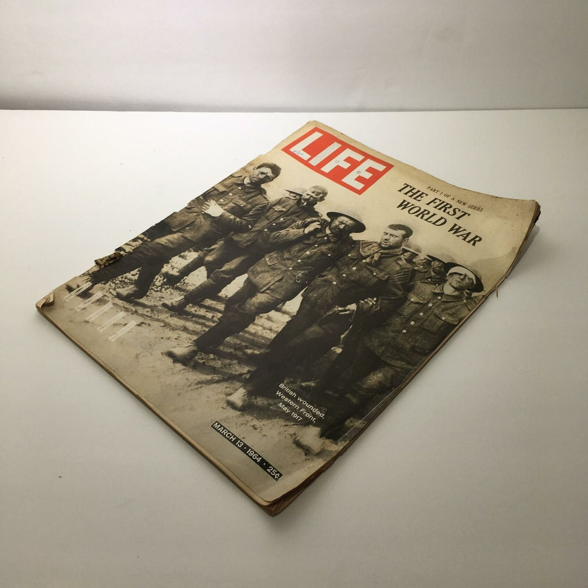 Vintage Life Magazine March 13 1964 cover showcasing the title 'The First World War' accompanied by a historical black and white photograph of soldiers.