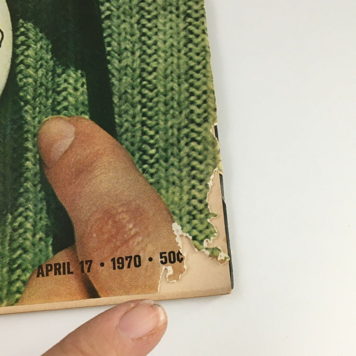Close-up of the corner of a vintage Life Magazine from April 17, 1970, featuring the date and price, showcasing wear and tear characteristic of its age.