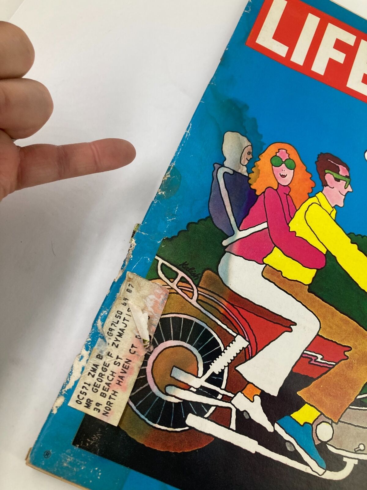 Close-up view of the VTG Life Magazine cover from August 14, 1970, highlighting the address label and wear marks on the vibrant design that depicts summer nomads.