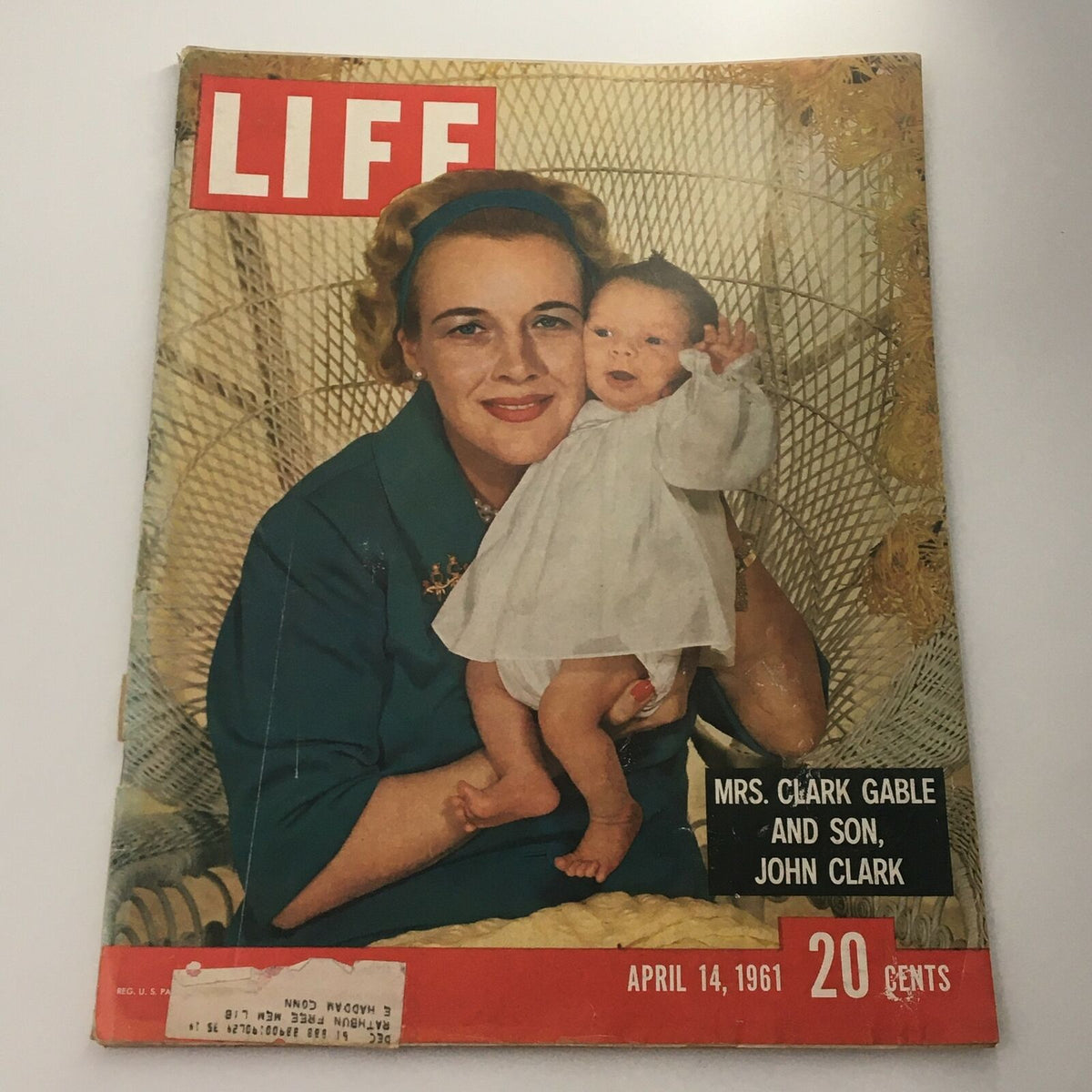 Vintage Life Magazine cover from April 14, 1961 featuring Mrs. Clark Gable and her son John Clark, showcasing a moment of motherhood with vibrant colors and nostalgic design.