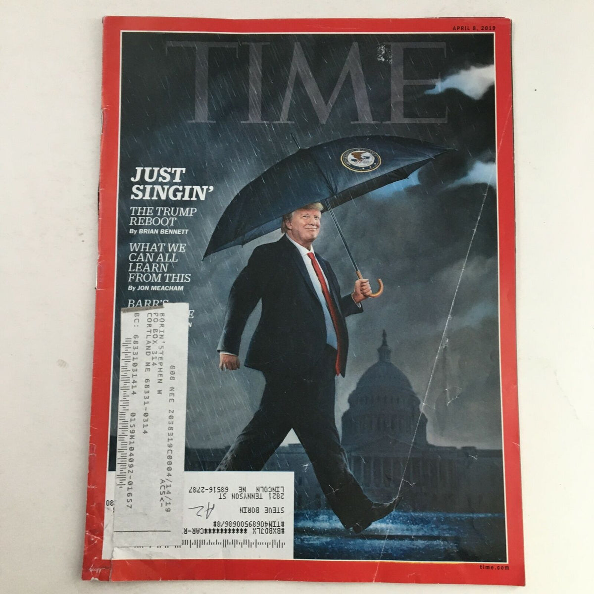 Cover of Time Magazine April 9 2019 featuring a photo of Donald Trump walking with an umbrella, under the headline 'Just Singin' The Trump Reboot', set against a backdrop of the U.S. Capitol building.