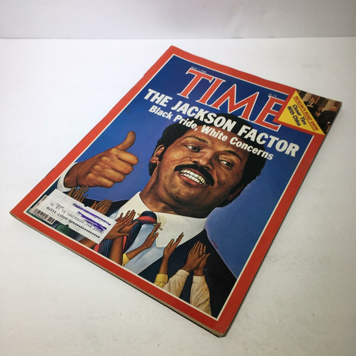 Time Magazine cover dated May 7, 1984, featuring the title 'The Jackson Factor: Black Pride, White Concerns', showcasing a man with a thumbs-up gesture against a colorful background with raised hands symbolizing support.