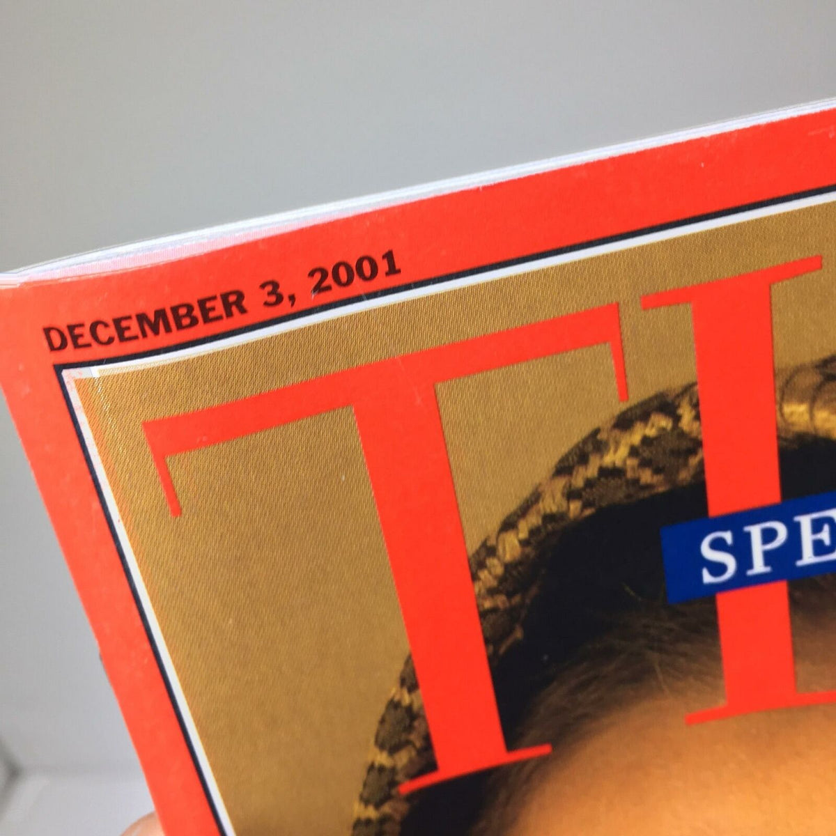 Detailed view of the date on Time Magazine's cover from December 3, 2001, associated with the article 'Lifting The Veil' addressing the Taliban's treatment of women.