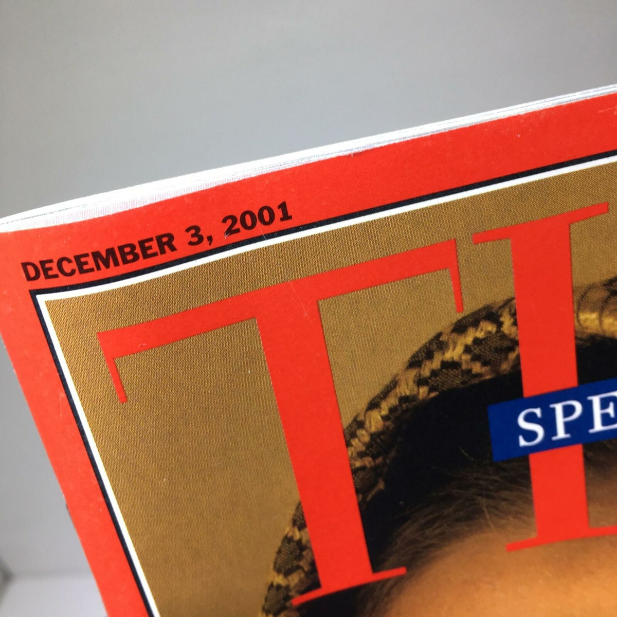 Cover detail of Time Magazine dated December 3, 2001, titled 'The Story of How Taliban Brutalized Women of Afghanistan' showcasing the publication date.