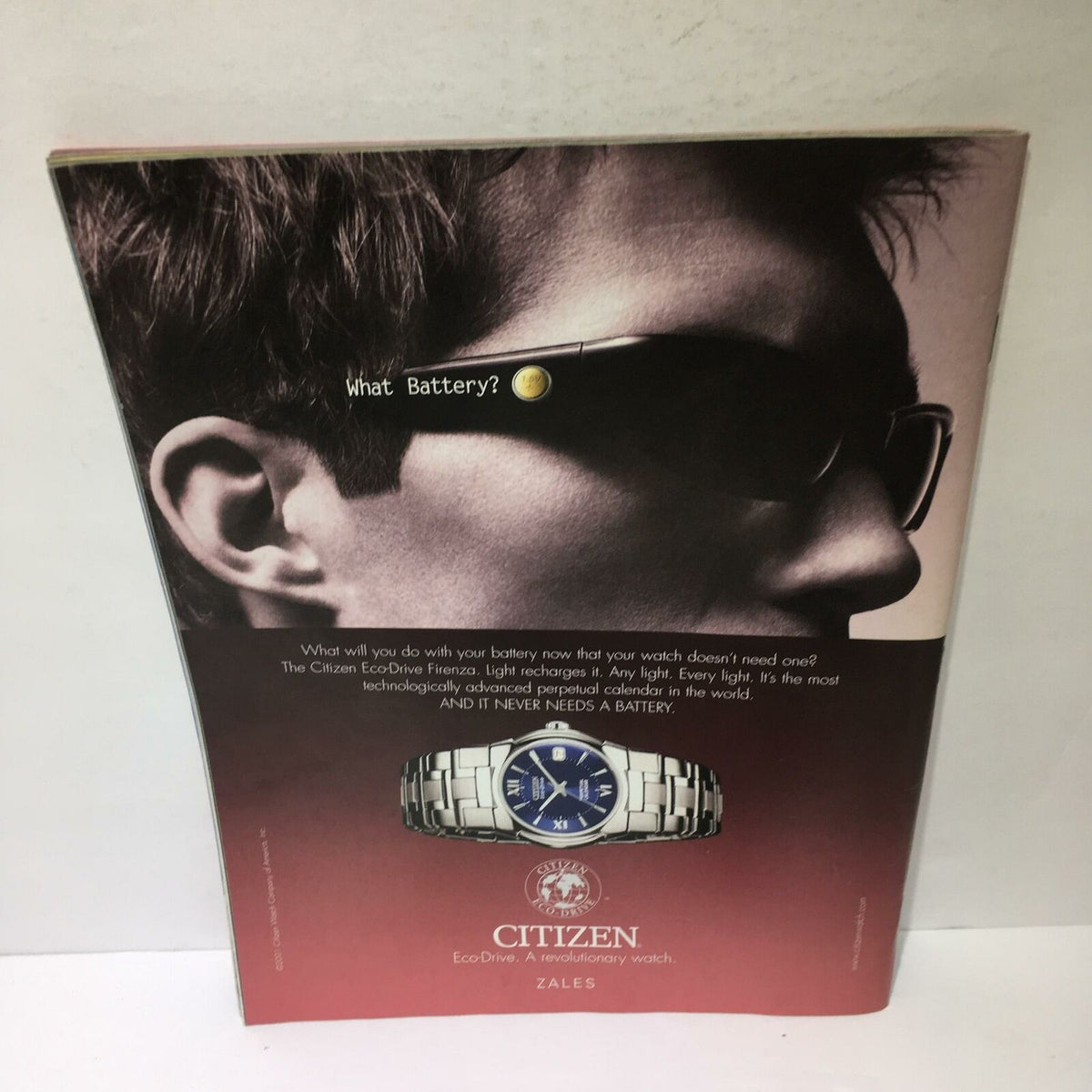 Advertisement for Citizen Eco-Drive watch featured in Time Magazine, December 3, 2001, highlighting innovative features.