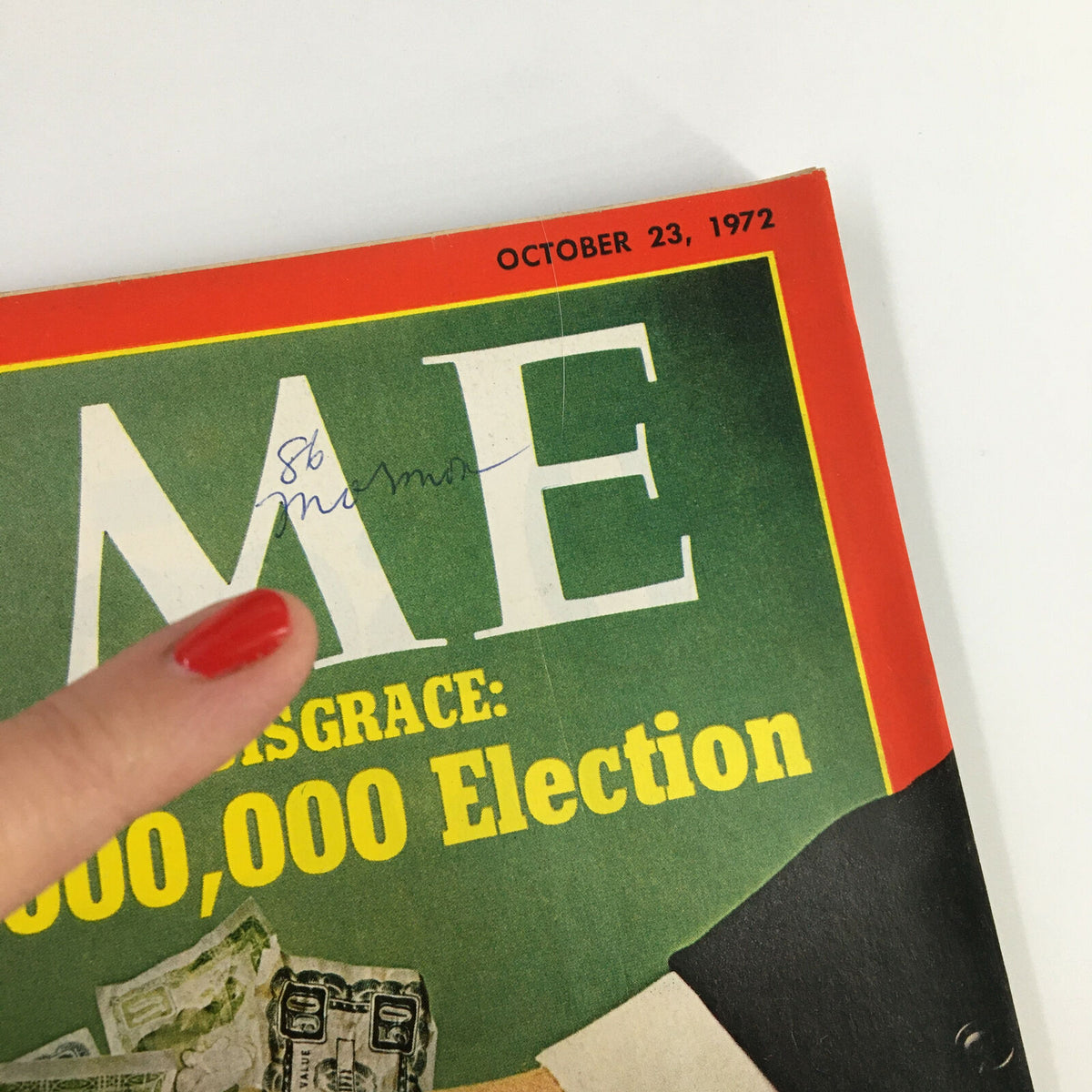 Close-up of the top section of the October 23, 1972, VTG Time Magazine cover titled 'A National Disgrace: The $400,000,000 Election', showcasing a handwritten note and the magazine's name highlighted.