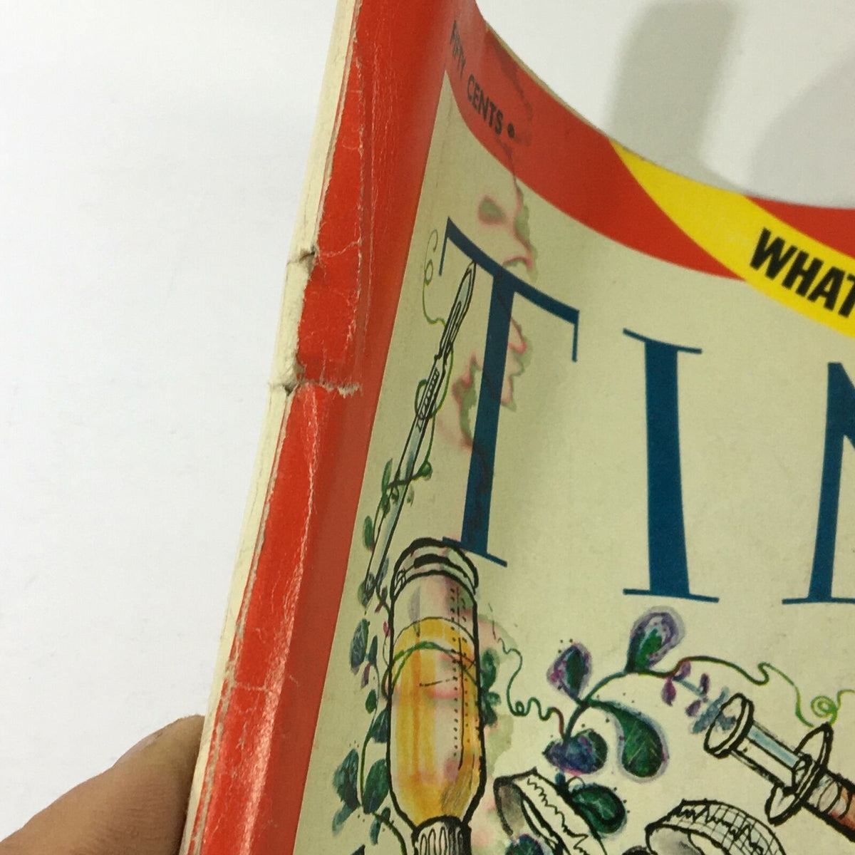 Side view of vintage Time Magazine February 21, 1969, showcasing the spine and edge wear, highlighting its vintage condition and the title 'What's Wrong with U.S. Medicine'.