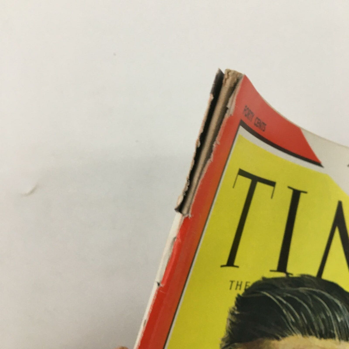 Close-up of the top edge of the VTG Time Magazine November 11, 1966 featuring Bishop Pike, displaying fraying and wear due to age.