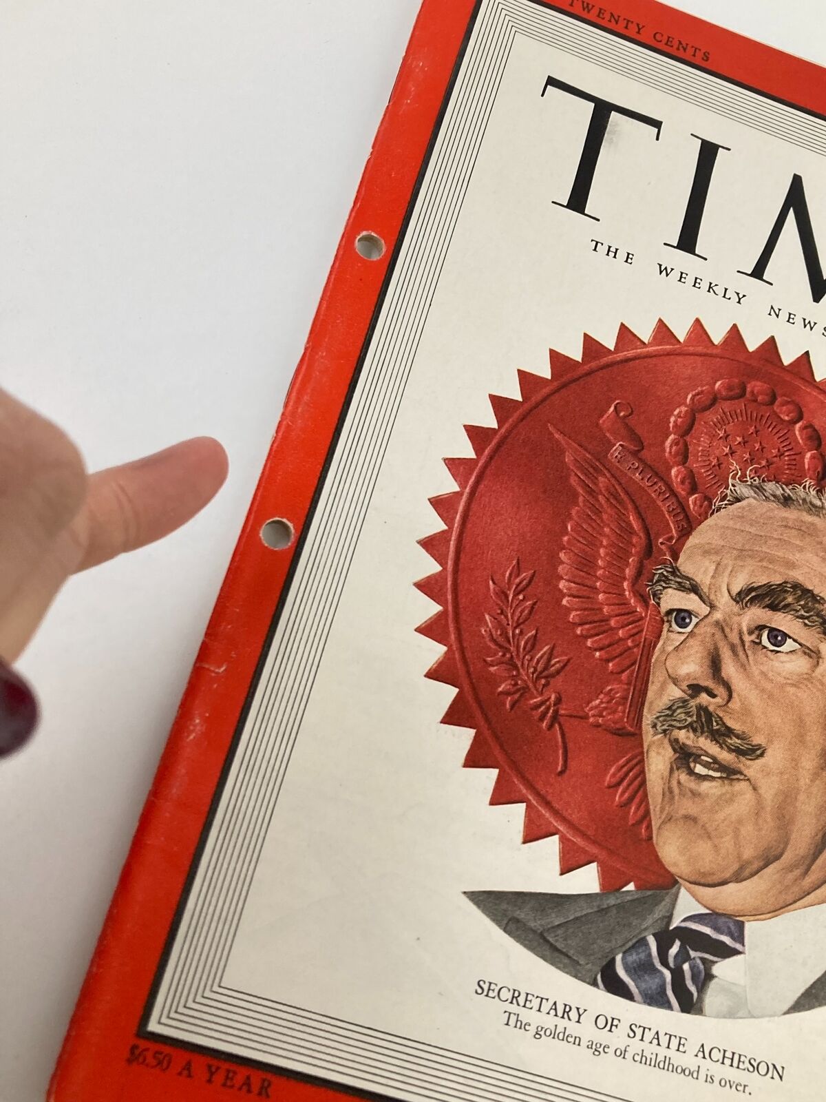Close-up of the binding of VTG Time Magazine February 28 1949 Vol 53 #9, showcasing the hole-punched detail and the vibrant cover design including a portrait of Secretary of State Acheson.