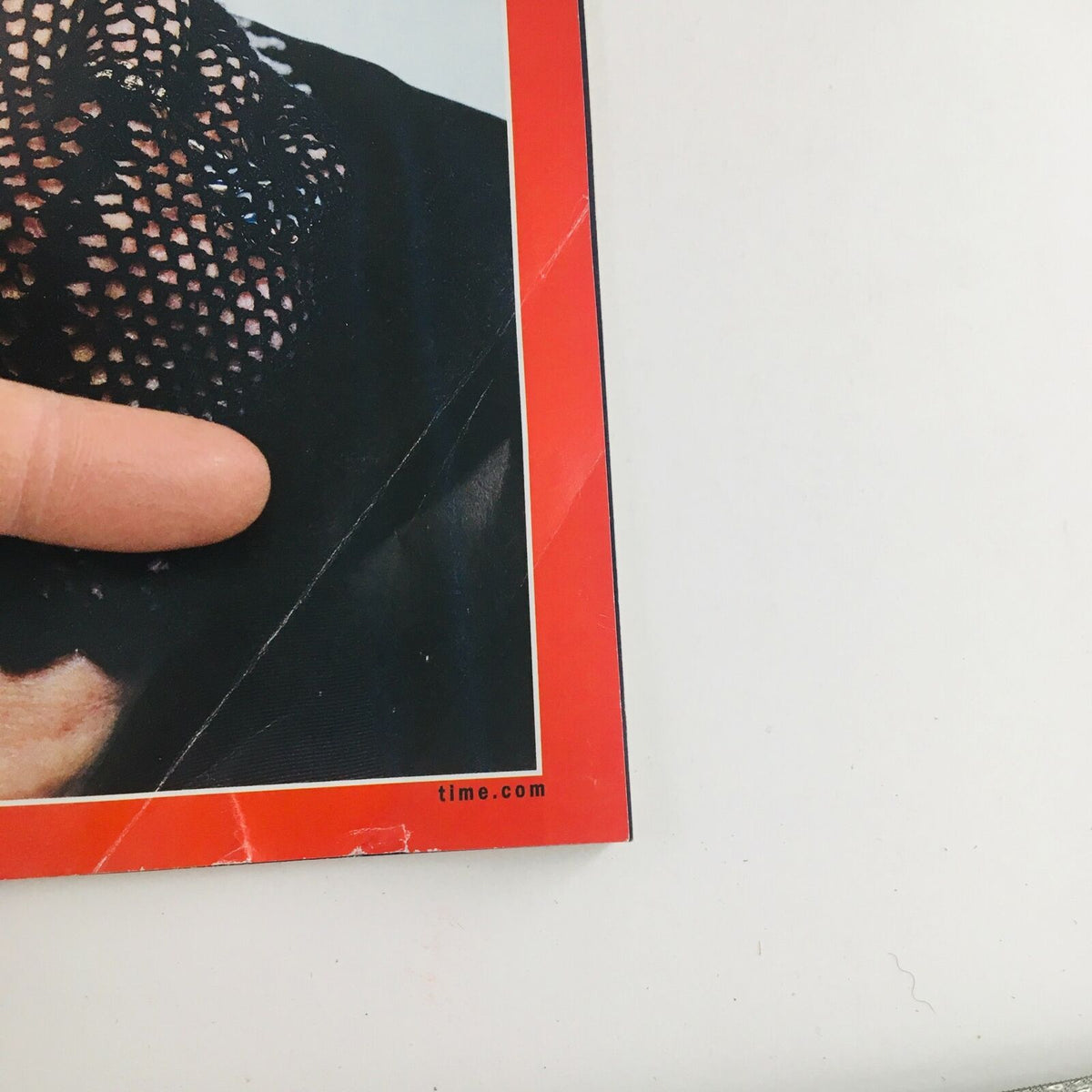 Close-up view of Time Magazine cover dated October 5, 2020, focusing on the corner of the magazine that features Ruth Bader Ginsburg's tribute.