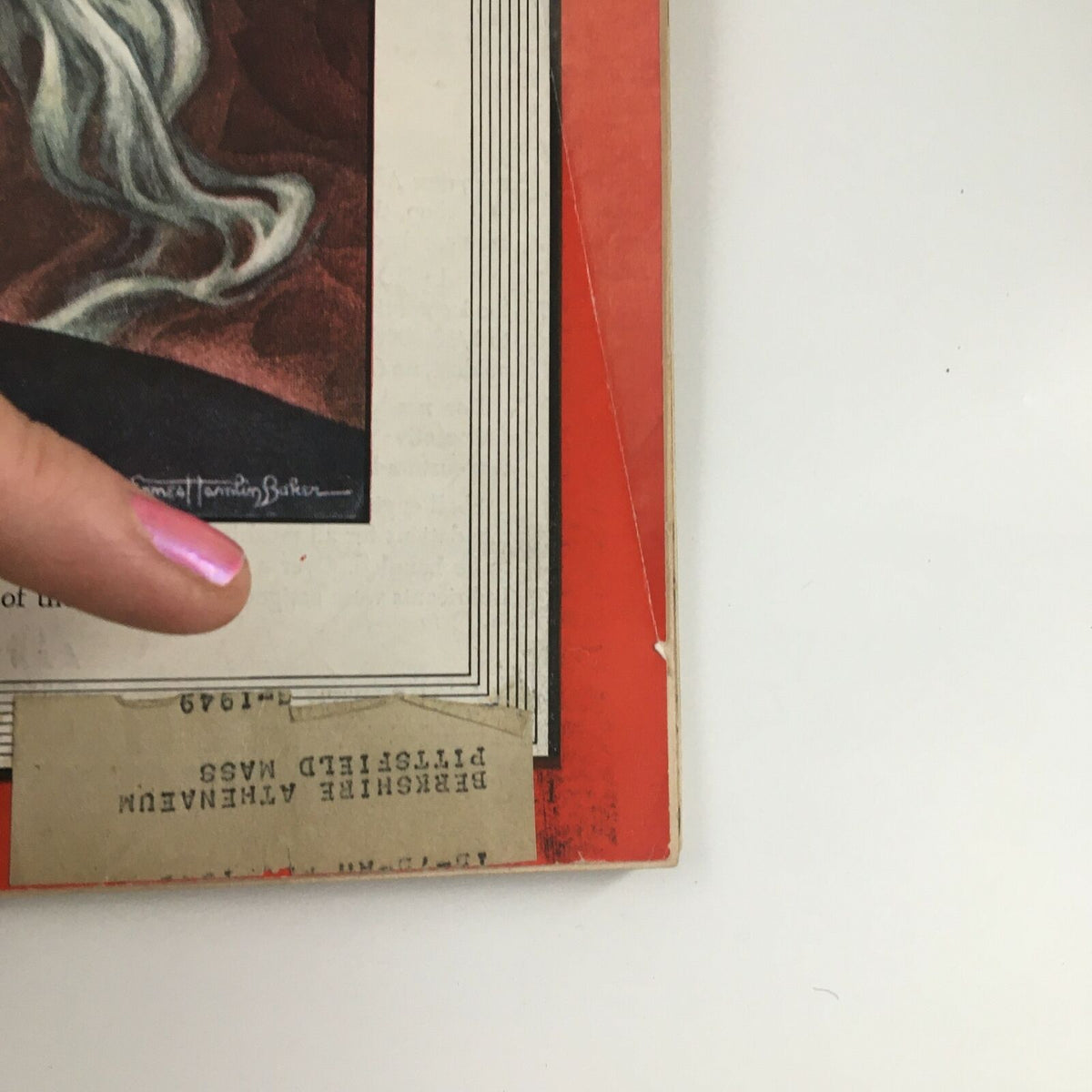 Close-up view of the bottom corner of the Time Magazine March 15 1948 cover, displaying a label from a library and unique signing by the artist, enhancing its collectible appeal.
