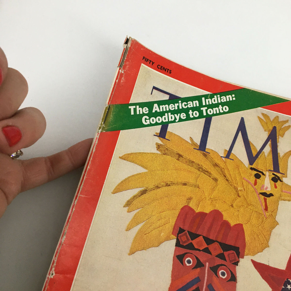 Close-up view of the edge of VTG Time Magazine February 9 1970, highlighting the article 'The American Indian: Goodbye to Tonto' and showing signs of wear.