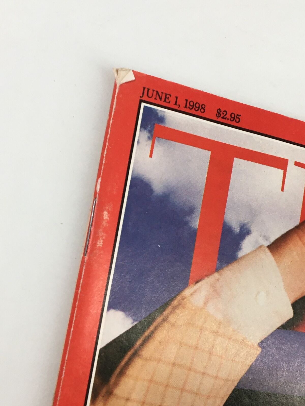 Detail of the corner of the vintage Time Magazine from June 1, 1998 showing the publication date and price.