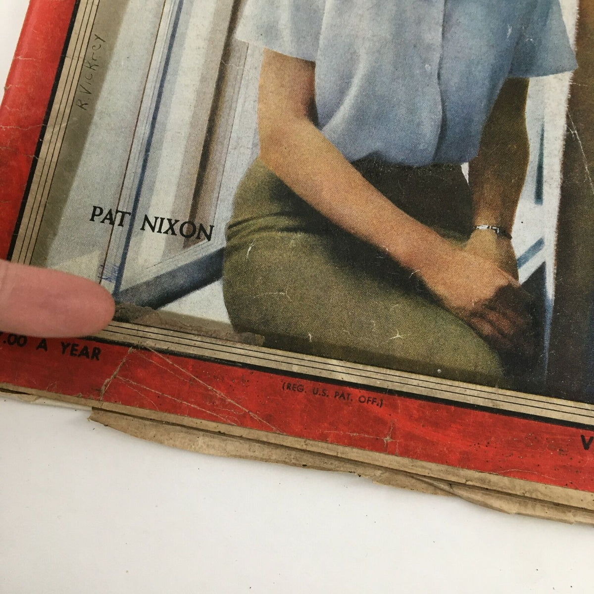 Detailed view of the Time Magazine cover featuring Patricia Nixon, February 29, 1960, showcasing the magazine's wear and vintage condition.