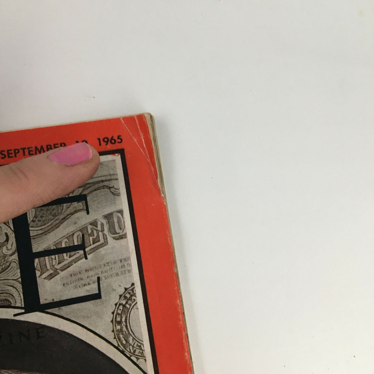 Close-up of the cover page of Time Magazine from September 10, 1965, featuring the date along with a portion of the magazine's title. This edition highlights U.S. Secretary of Treasury Henry H. Fowler, making it a collectible item for history enthusiasts.