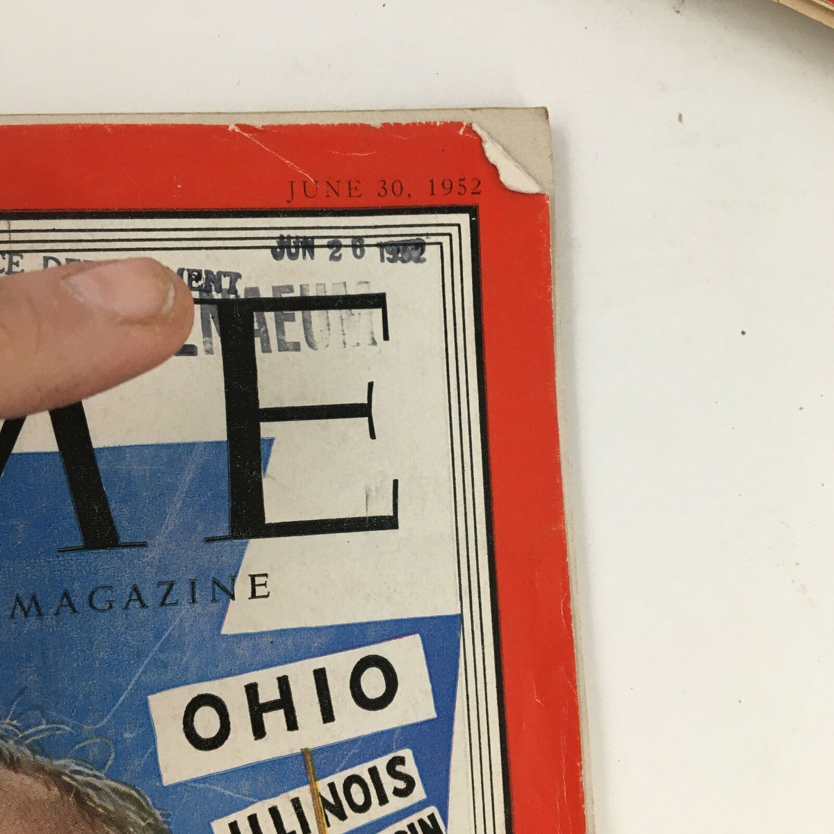 Close-up of Time Magazine cover dated June 30, 1952, depicting the title and date, with a hand pointing to a stamped date. The cover highlights American lawyer and judge John S. Fine and includes state references.