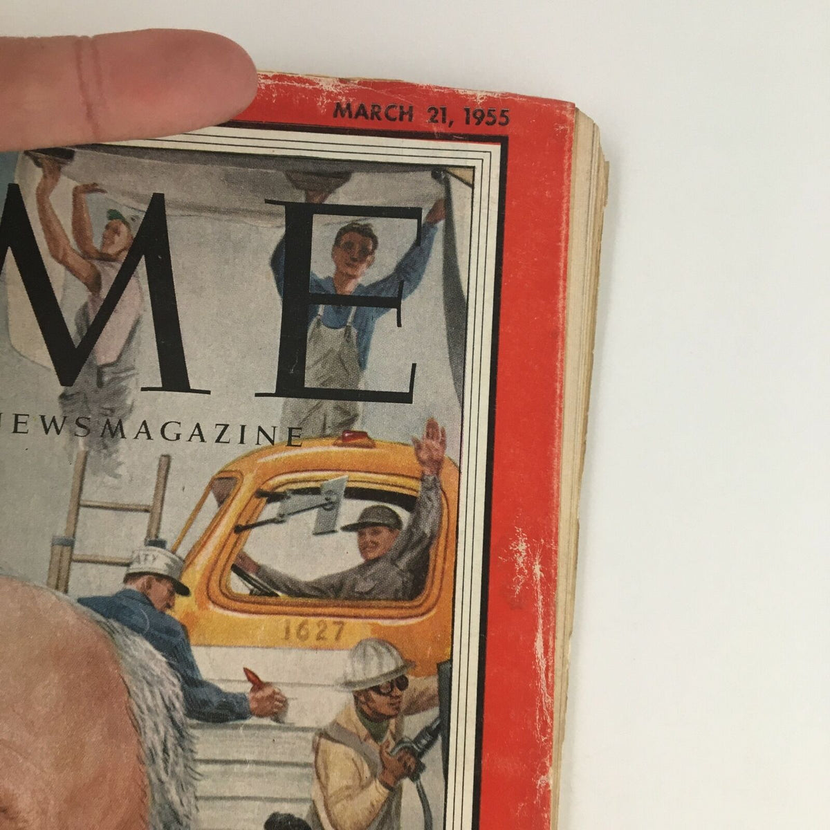 Close-up of the upper corner of Time Magazine, dated March 21, 1955, showcasing the magazine logo and highlighting the iconic cover art dedicated to George Meany.