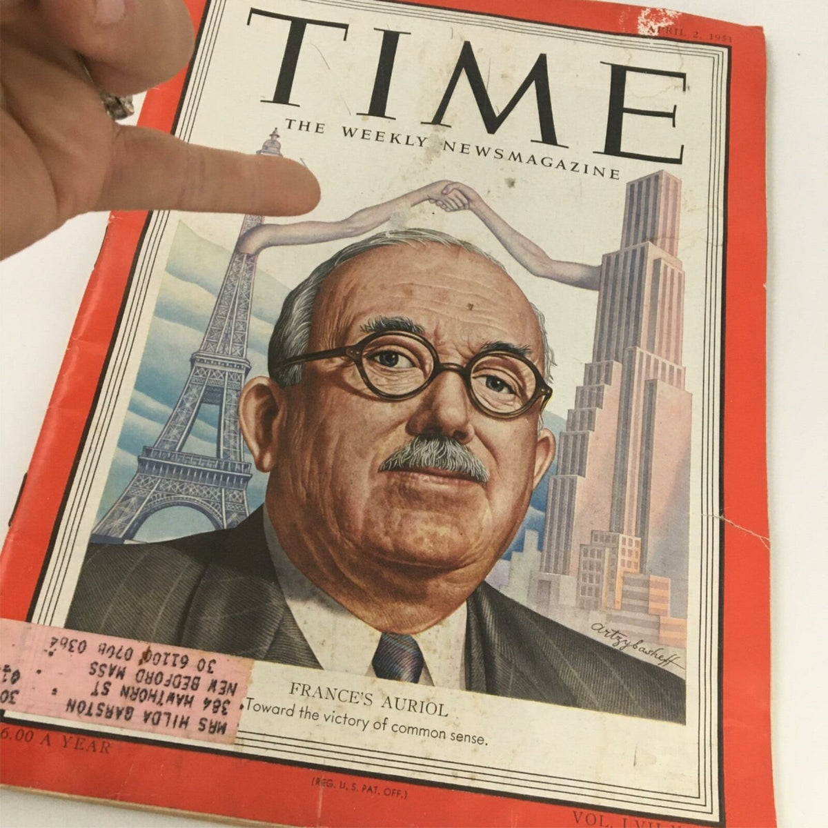 Vintage Time Magazine cover featuring Frances Auriol from April 2, 1951, showcasing a detailed illustration of Auriol with iconic landmarks in the background, including the Eiffel Tower. The magazine highlights historical events and offers a glimpse into the past with an emphasis on the 'victory of common sense' theme.