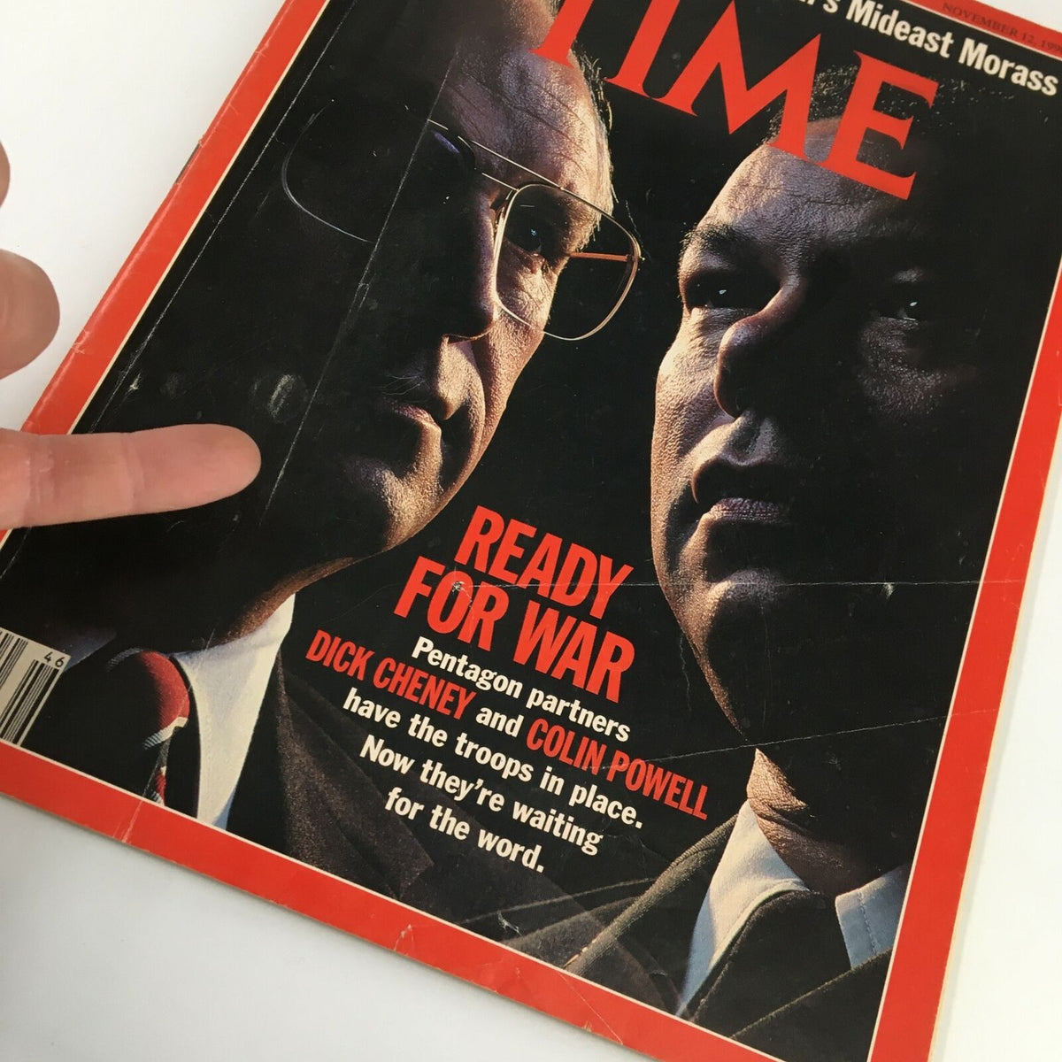 Detailed perspective of Time Magazine November 12, 1990 cover showing Dick Cheney and Colin Powell, with the headline 'Ready for War' and a finger pointing at the magazine, emphasizing its significance in political memorabilia.