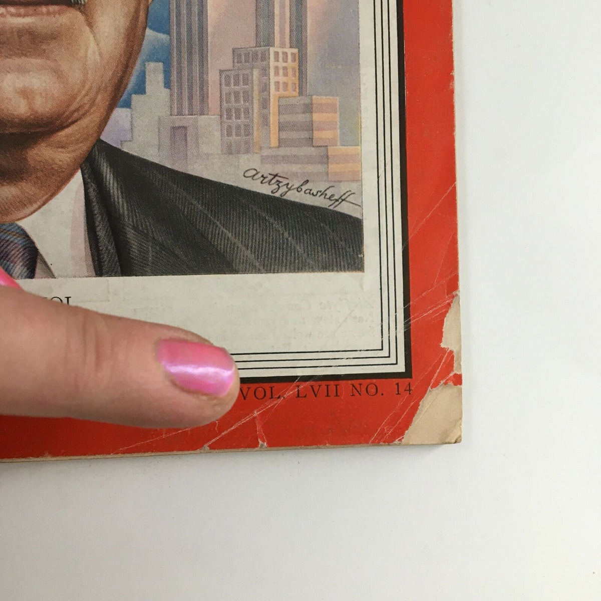 Close-up of the Time Magazine April 2 1951 Vol 57 #14 cover showing imperfections such as a crease and wear, with a finger pointing at the area.