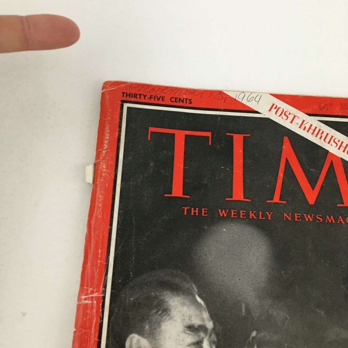 Close-up view of the Time Magazine cover from November 13, 1964, focusing on the title and date, showcasing Chou En-Lai and Alexei Kosygin.