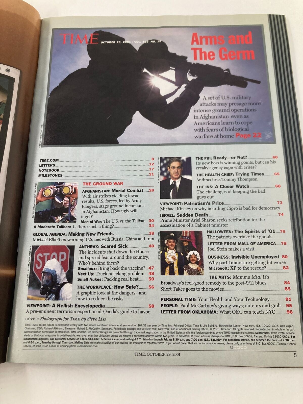 Inside page of Time Magazine, October 29, 2001, depicting a silhouette of a soldier and the article 'Arms and The Germ' related to biological warfare.