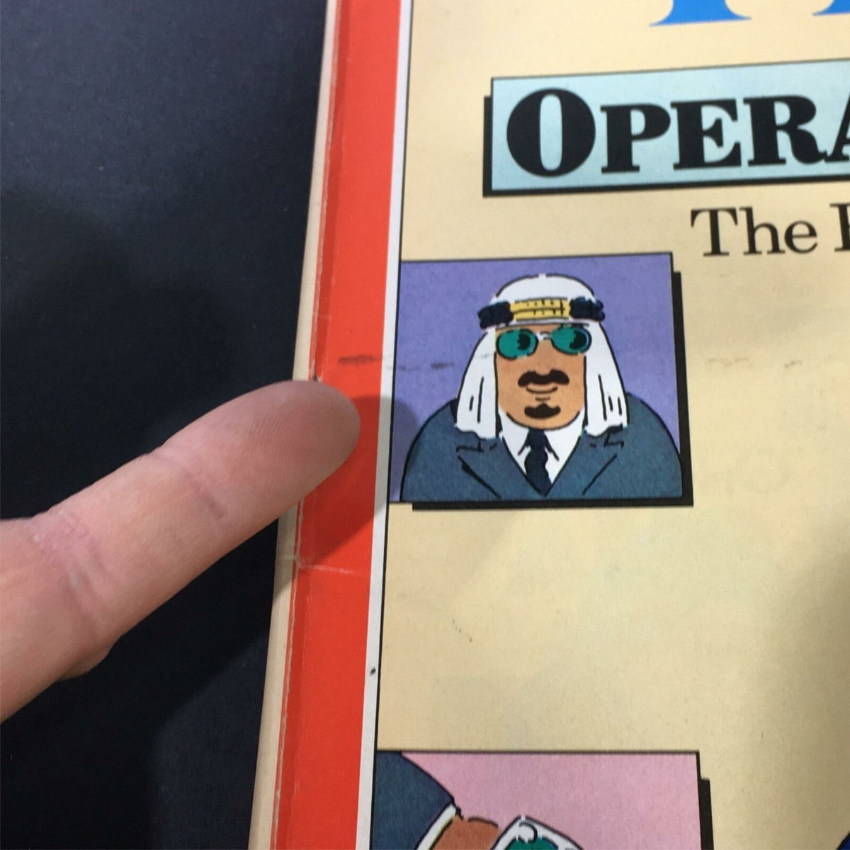 Close-up of the spine and edge of VTG Time Magazine February 18 1980 depicting a character from the cover artwork, emphasizing minor wear on the magazine.