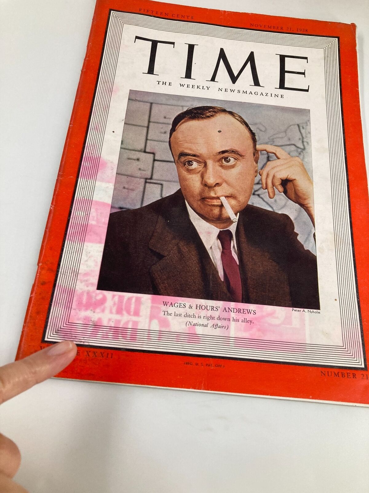 Cover of VTG Time Magazine dated November 21, 1938, featuring an article on 'Wages & Hours' by Andrews, showcasing a man with a cigarette deep in thought.