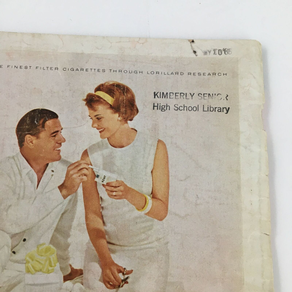 Another view of the Kent cigarettes advertisement inside Time Magazine Vol 84 No. 26, December 25 1964, showcasing a library stamp and vintage design.
