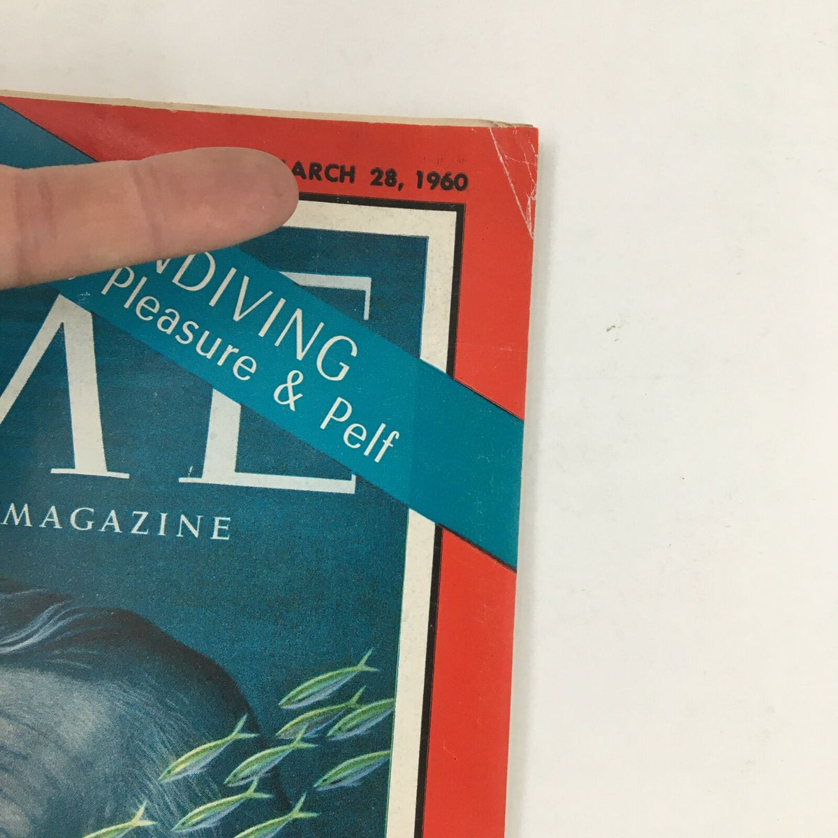 Close-up of Time Magazine from March 28, 1960, Volume 75, No. 13 showcasing the cover detail with the title 'Skindiving, Poetry, Pleasure & Pelf' by Jacques Cousteau.