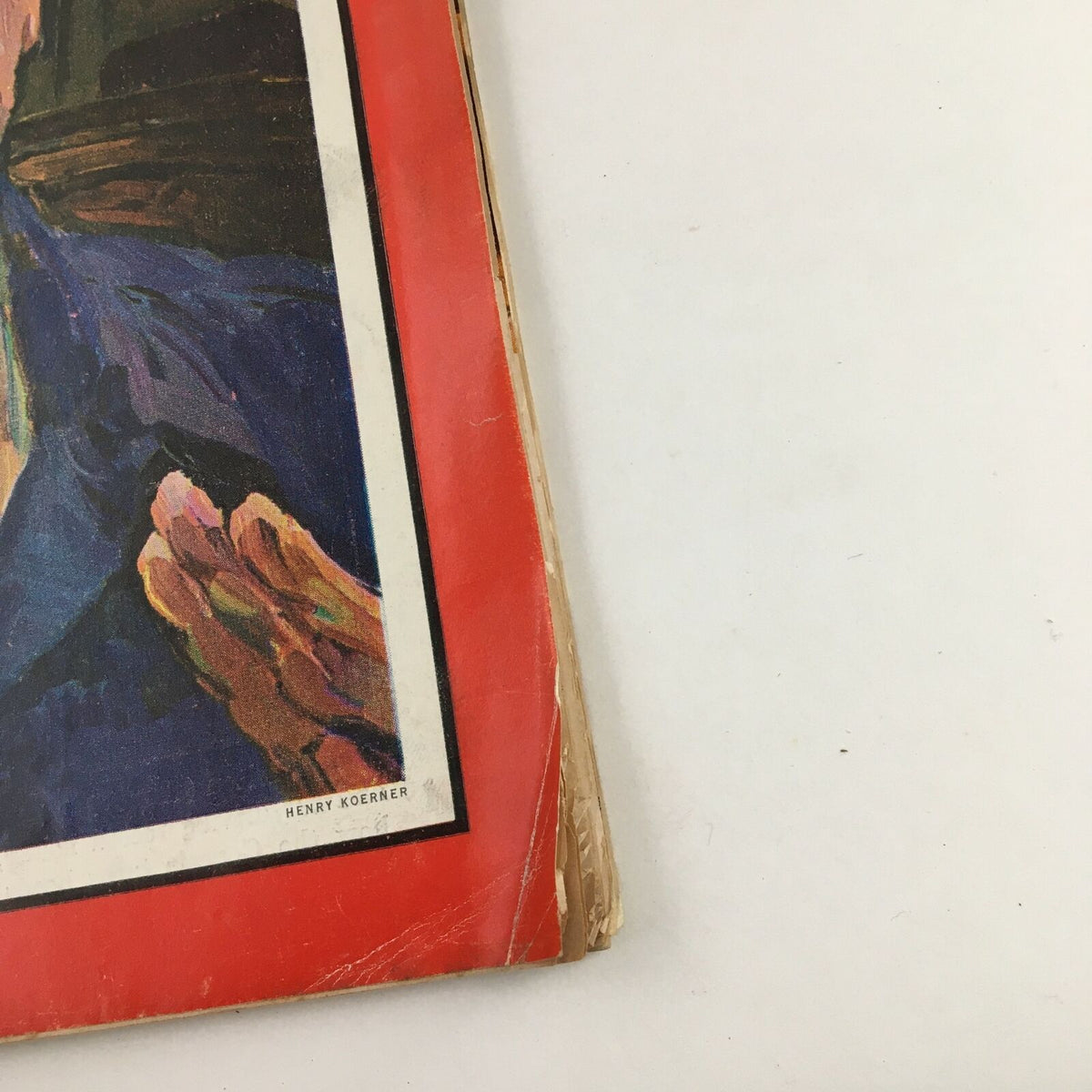 Side view of the Time Magazine cover from February 22, 1963, showcasing the vintage publication's slightly worn edges and the signature of the illustrator, Henry Koerner.