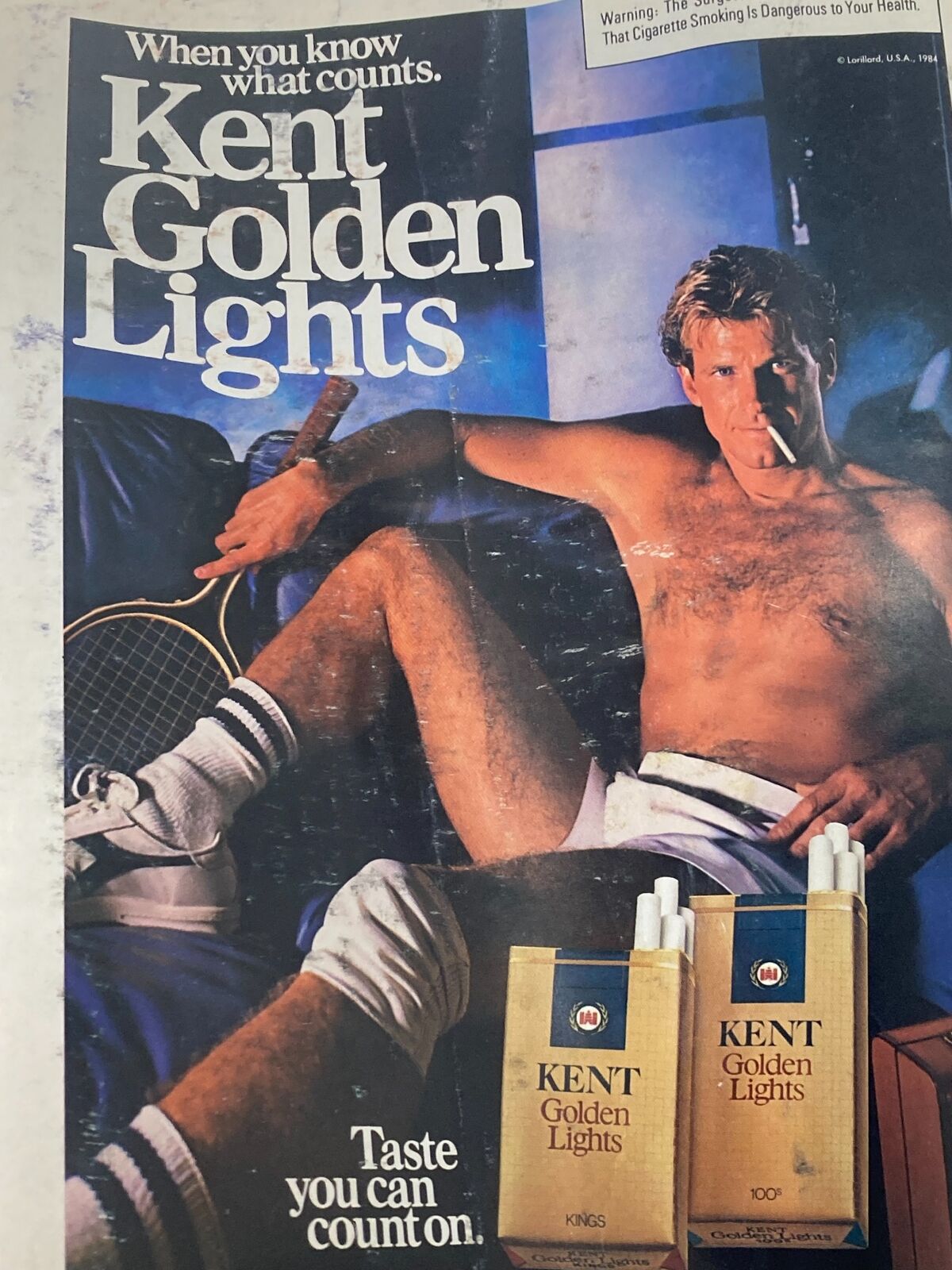 Advertisement in the vintage Time Magazine from April 16, 1984 for Kent Golden Lights cigarettes, featuring a male model.