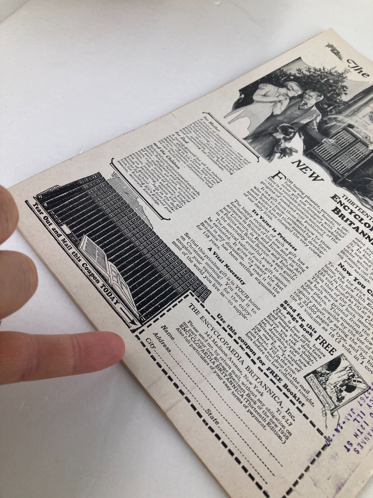 Inside page of the VTG Time Magazine November 15 1926 showcasing details of the Encyclopedia Britannica with a finger pointing at the information.