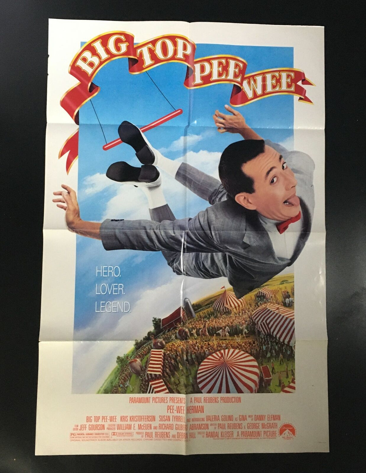 1988 Big Top Pee-Wee Herman 41" x 27" Original Movie Poster featuring Paul Reubens, showcasing vibrant colors and whimsical design, depicting the character in a playful circus setting with the tagline 'Hero. Lover. Legend.'