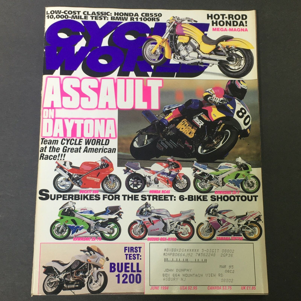 Cover of Cycle World Magazine June 1994 featuring a comparison of Honda CB550 and BMW R1100RS. Highlights include references to racing events and various motorcycle models, making it a valuable resource for motorcycle enthusiasts.