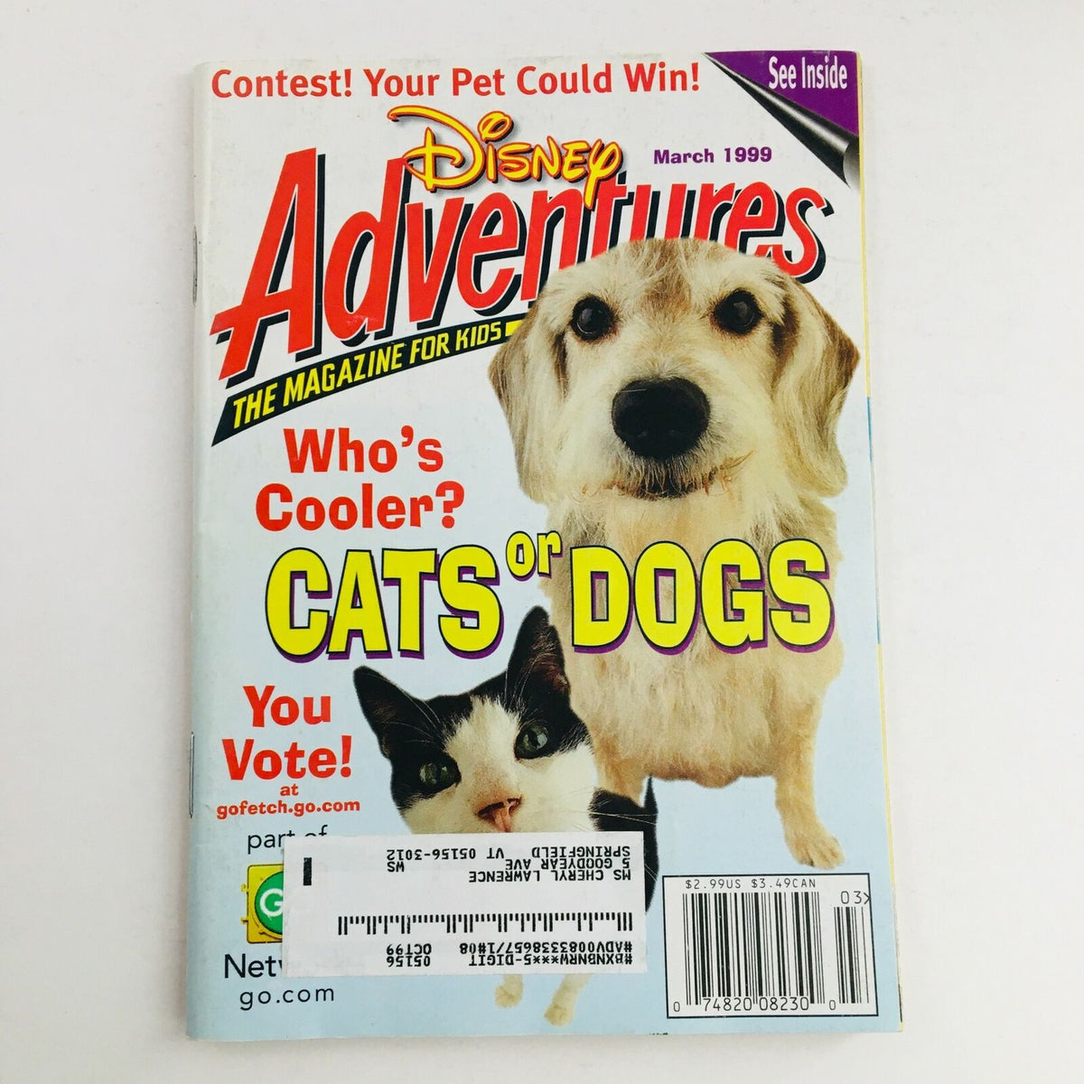 Cover of Disney Adventures Magazine from March 1999 featuring the title 'Who Is Cooler? Cats or Dogs? Vote Now!' with a dog and a cat. A vintage collectible showcasing late-90s pop culture.