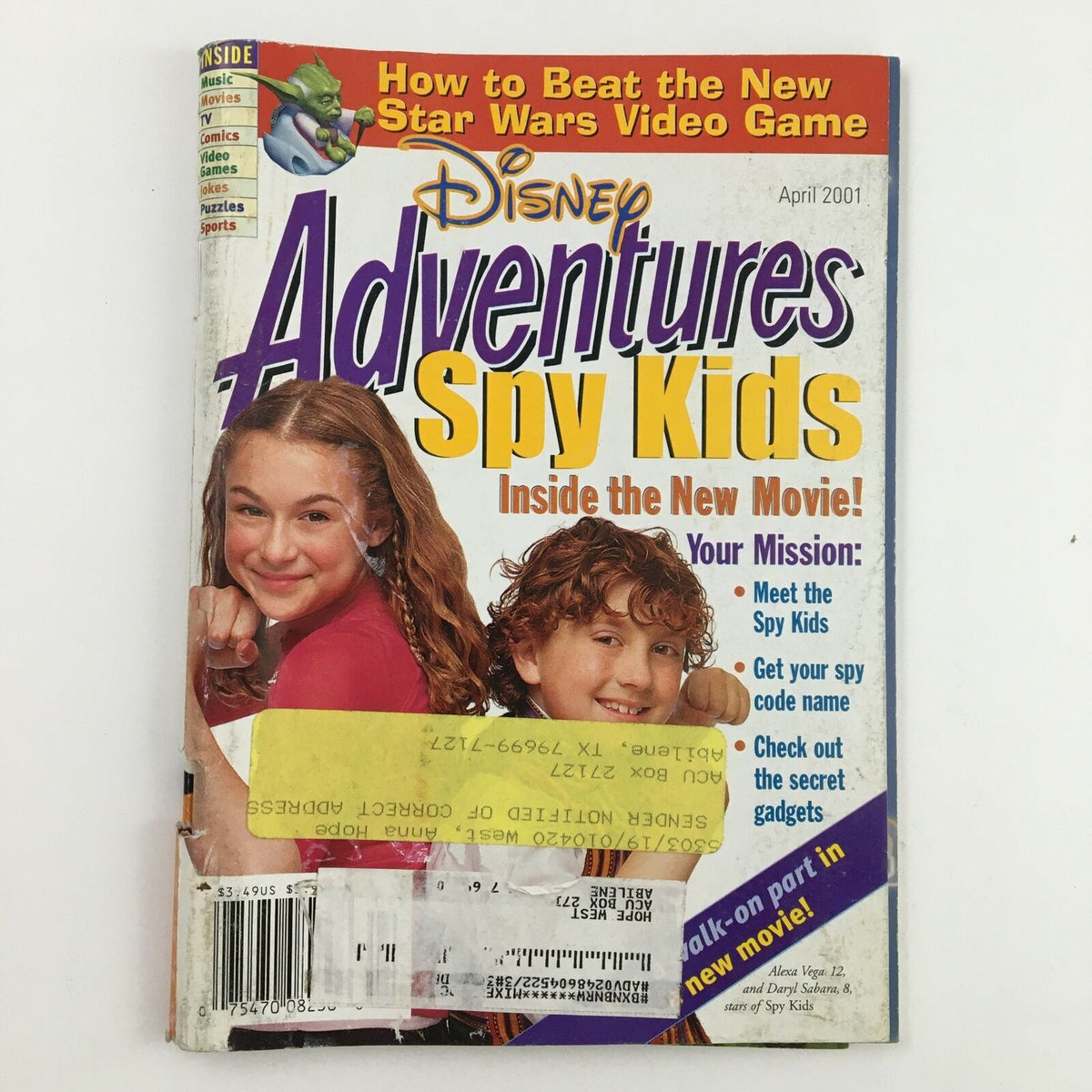 Cover of Disney Adventures Magazine April 2001 featuring Spy Kids, highlighting the new movie with a layout featuring characters and game previews.