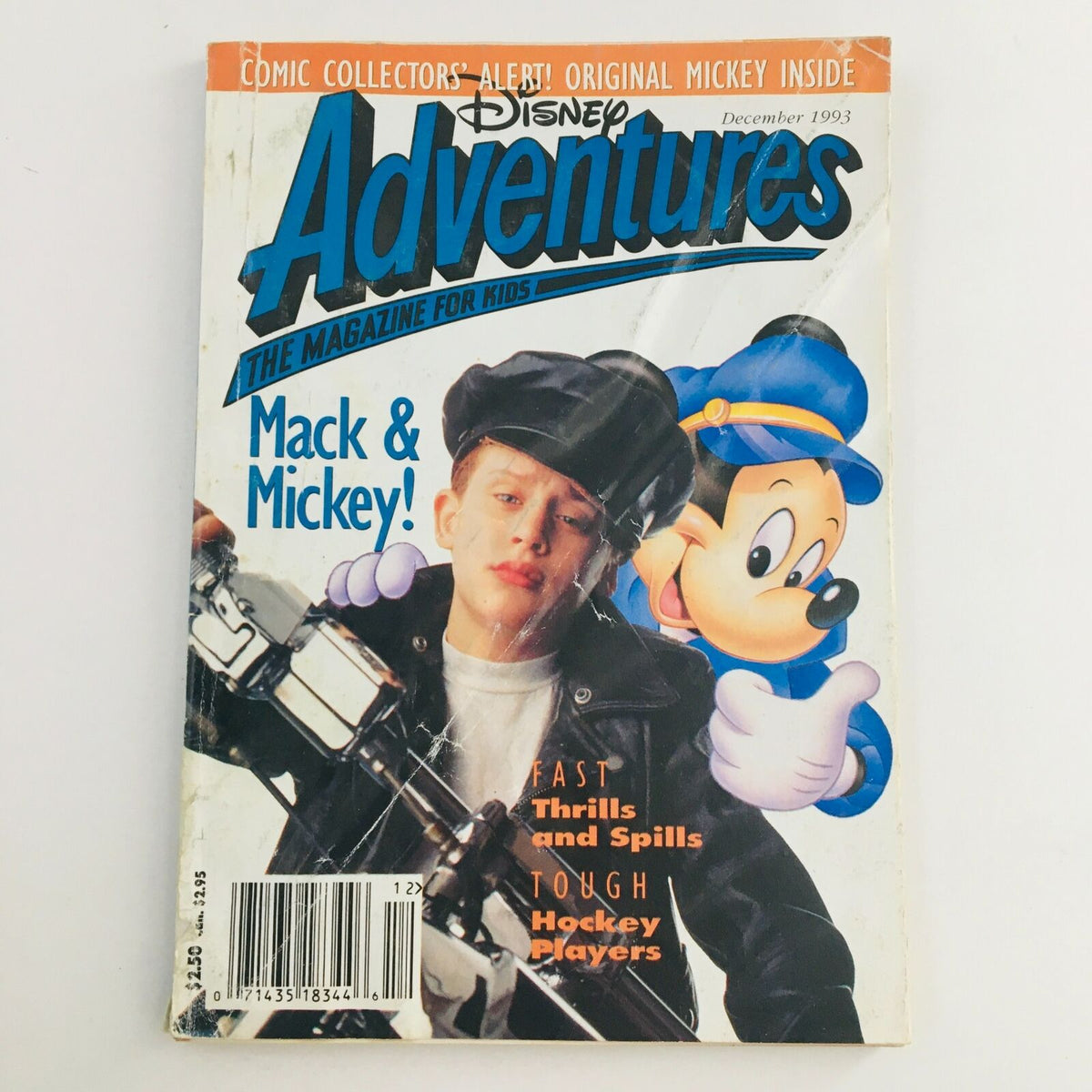 Disney Adventures Magazine December 1993 featuring Macaulay Culkin and Mickey Mouse, showcasing vintage pop culture with engaging articles and illustrations.