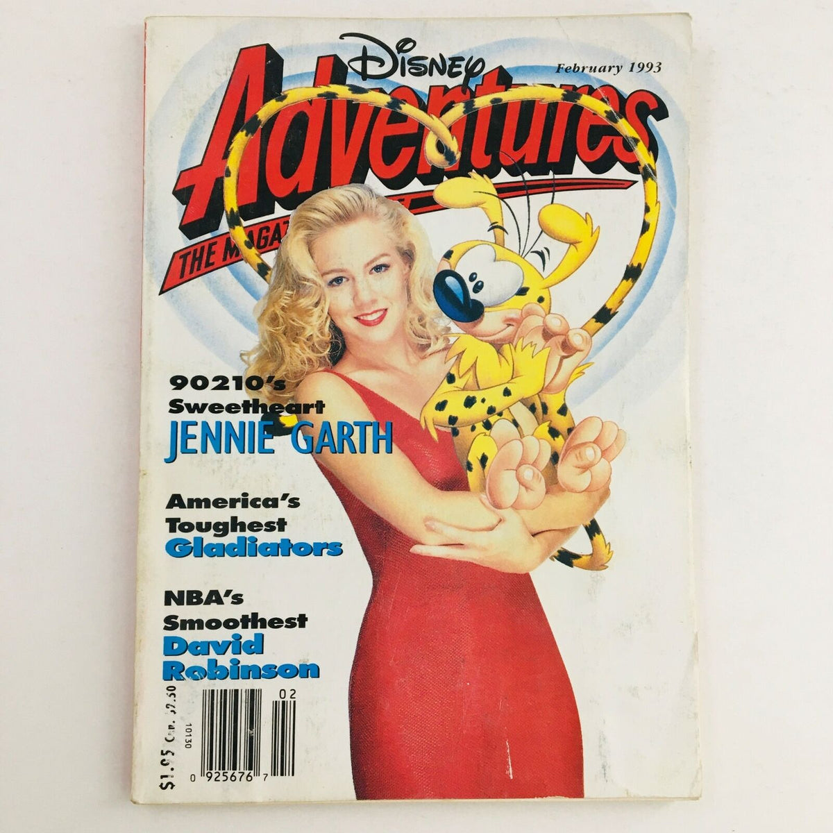 Disney Adventures Magazine February 1993 cover featuring Jennie Garth in a red dress holding a character, alongside text highlighting her role as 90210's Sweetheart and mentioning NBA's David Robinson.
